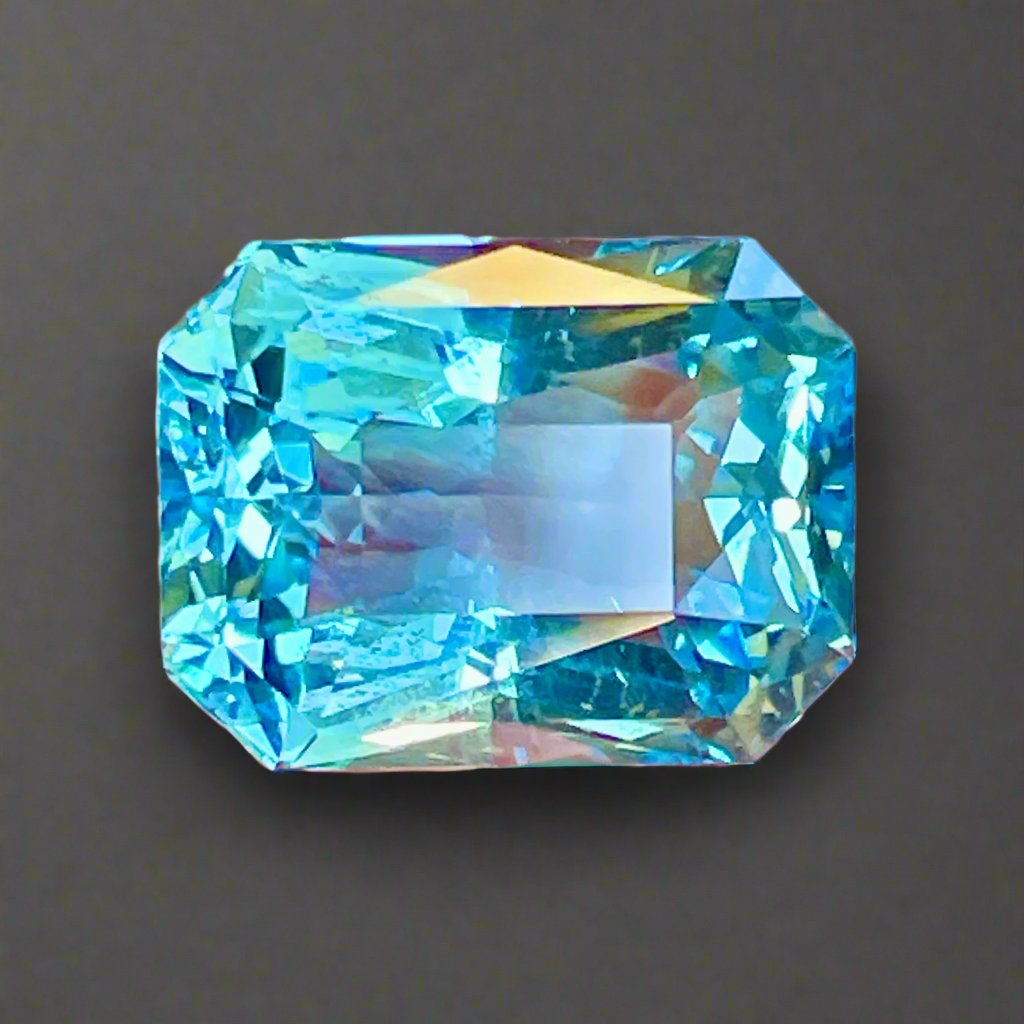  This is a large beautifully cut aquamarine in a gorgeous blue. It really works the light and sparkles. It would be suitable for a large statement ring, bracelet or pendant/enhancer. Let us custom mount this gem for you using our world class jewelers who partner with us to save you money and get the highest quality. We can replicate almost any photo you send 