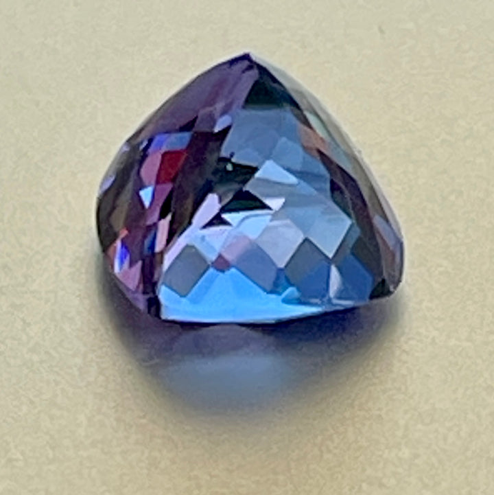 Gorgeous, tanzanite, old mine material, blue-blue with hint of violet, occasional red flashes. Cushion cut with precision faceting.