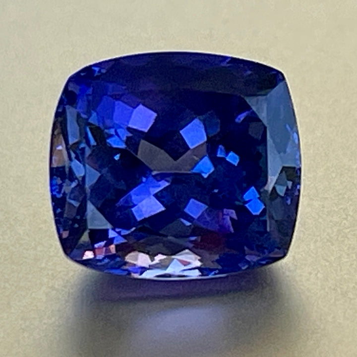 Gorgeous, tanzanite, old mine material, blue-blue with hint of violet, occasional red flashes. Cushion cut with precision faceting.