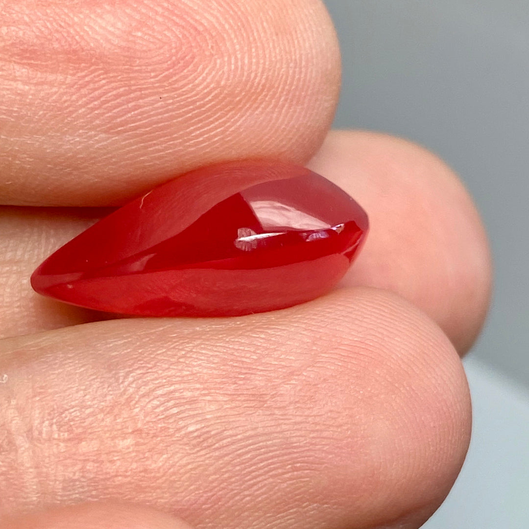 Rhodochrosite Cabochon, 14.92 ct. Translucent, Tear drop. Highly polished, Top Grade.